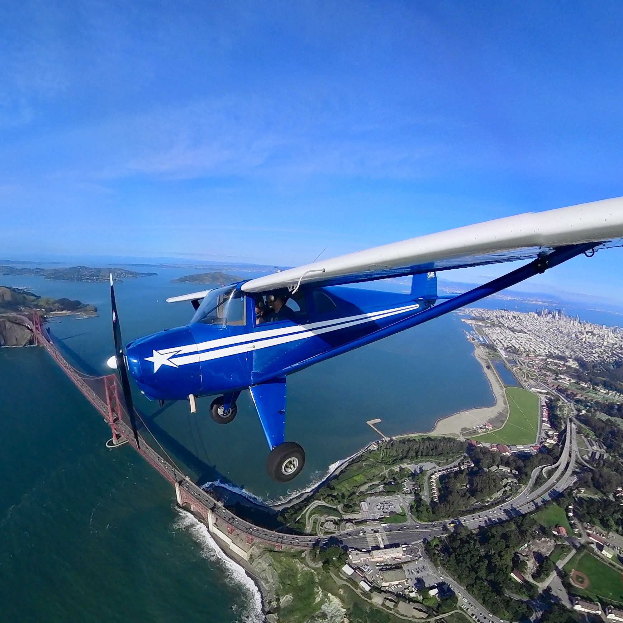 Blue Tailwheel Aircraft Landing