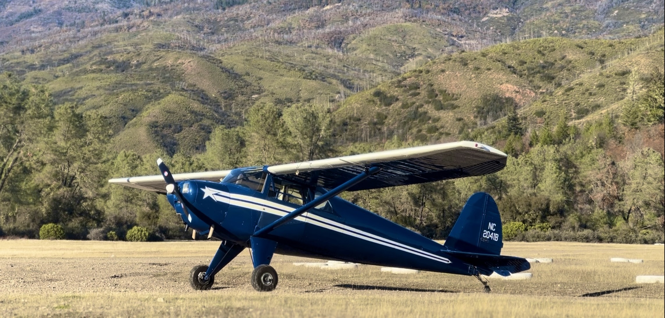 Vintage Aircraft Flying Over Bay